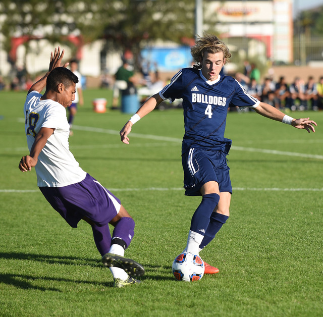 Centennial’s Logan Bodnar (4) battles for the ball against Durango’s Marcos Delg ...