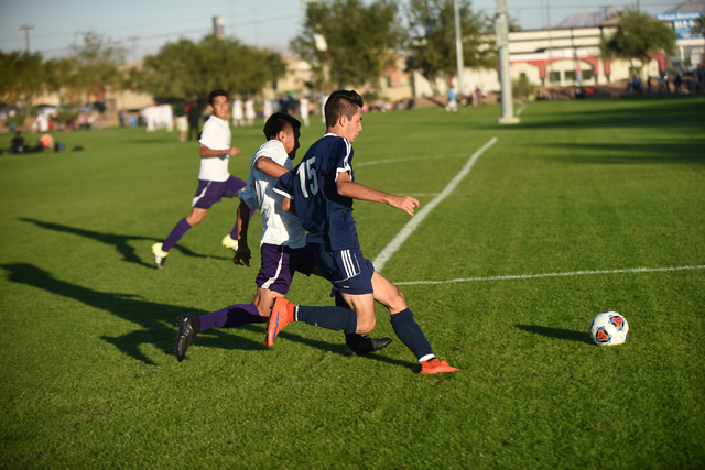 Centennial’s Caden Usiak (15) battles for the ball against Durango’s Alfredo Rob ...