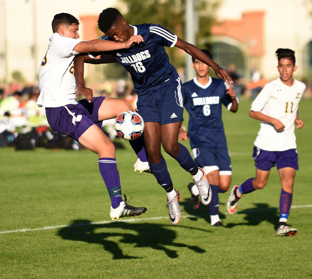 Centennial’s Quentin Scott (18) battles for the ball against Durango’s Alfredo R ...