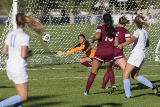 Eldorado goalie Dina Goc’ Ong (8) dives to try and block a shot during the Sunrise Reg ...