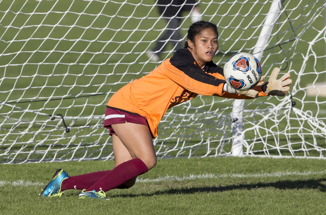 Eldorado goalie Dina Goc’ Ong (8) dives to try and block a shot during the Sunrise Reg ...