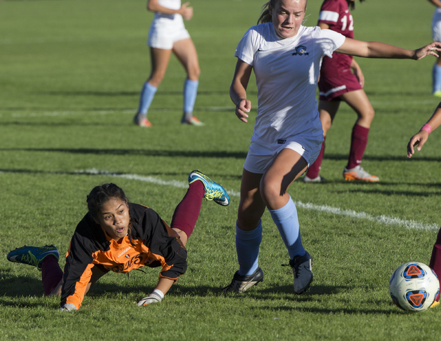 Eldorado goalie Dina Goc’ Ong (8) scrambles for a loose ball with Foothill’s Eli ...