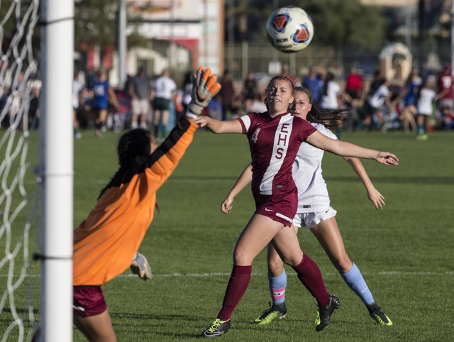 Eldorado’s Lauren Granger (4) watches a shot go wide of goalie Dina Goc’ Ong (8) ...