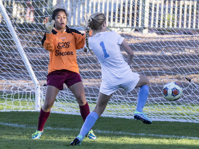 Eldorado goalie Dina Goc’ Ong (8) tries to block the shot of Foothill’s Alexi Hu ...