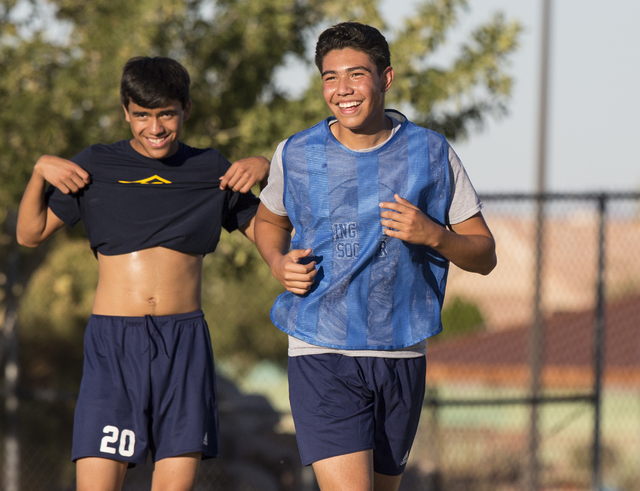 Spring Valley soccer player Jose Lopez, right, jokes around with teammates during practice ...