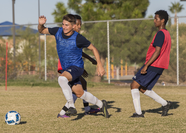 Spring Valley soccer player David Van Hoose, left, makes a run towards goal during practice ...