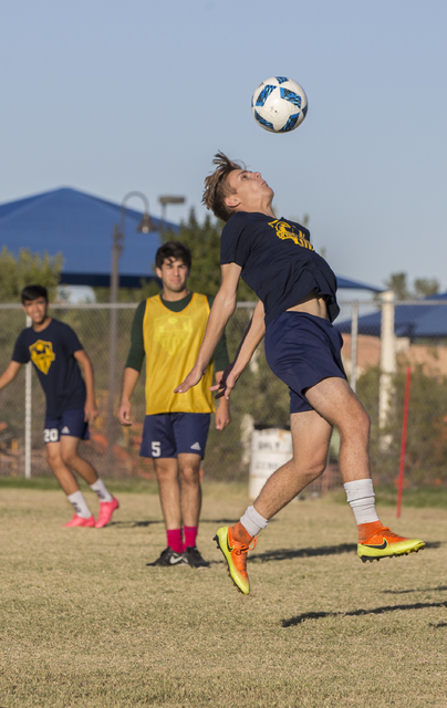 Spring Valley soccer player Ethan Orme (11) goes up for a header during practice on Wednesda ...