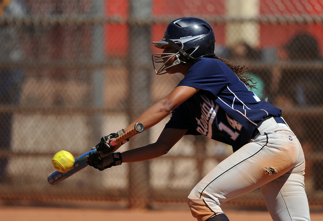 Centennial base second baseman Kiana Tate lays down a successful bunt against Brawley (Calif ...