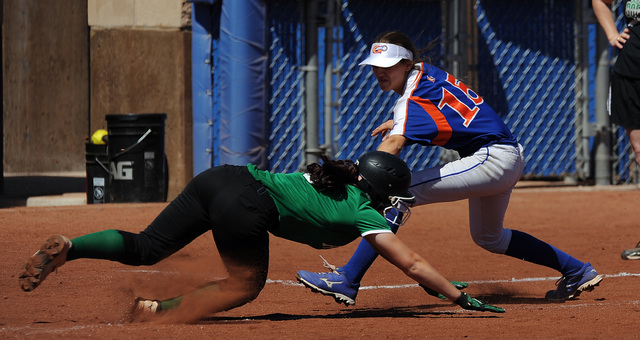 Rancho base runner Gianna Carosone is tagged out by Bishop Gorman third baseman Morgan Blann ...