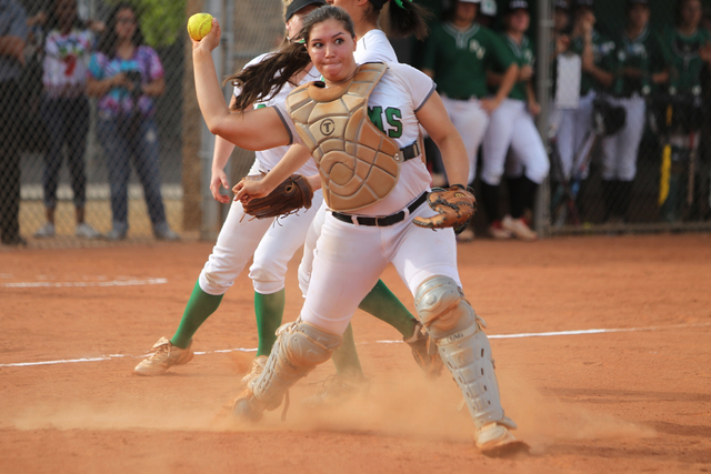 Rancho’s (1) McKinzi Vega throws a late pass to first base for a Palo Verde hit in the ...