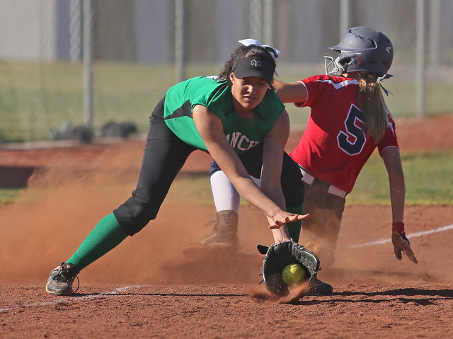 Rancho’s Kayla Coles, left, catches the ball as Coronado’s Tatum Spangler gets u ...