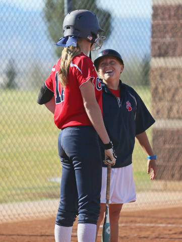 Coronado head coach Melissa Krueger, right, laughs while speaking with pitcher Sarah Pinksto ...