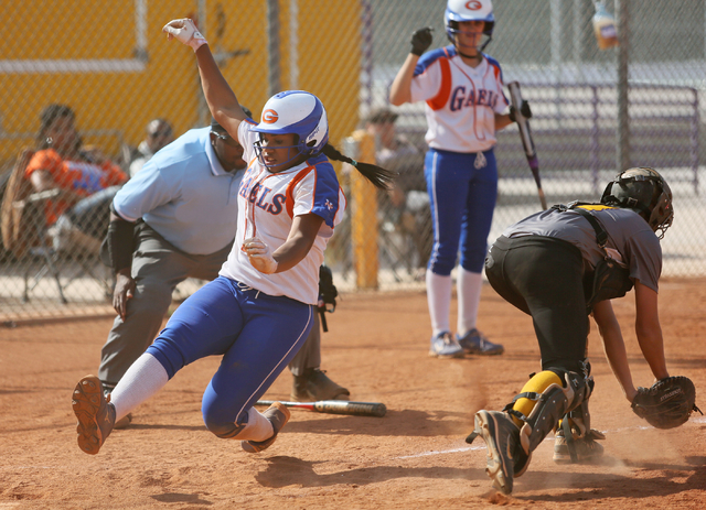 Bishop Gorman’s Jasmine Gibson, left, prepares to slide into home as Durango’s M ...