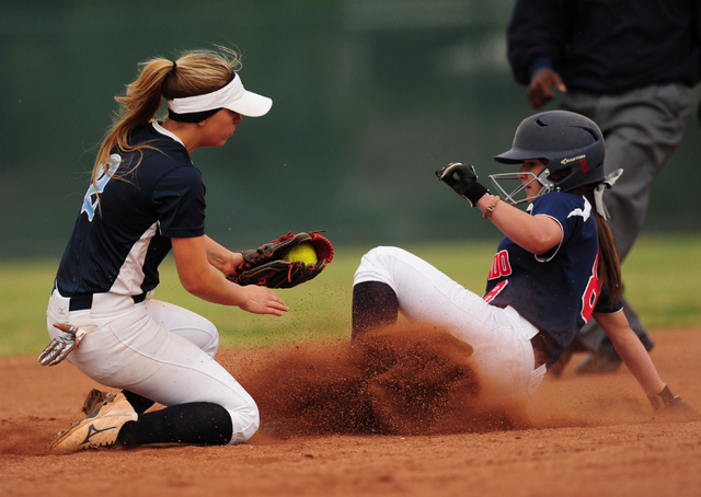 Coronado base runner Marissa Kopp steals second base while Foothill shortstop Kylie Becker f ...