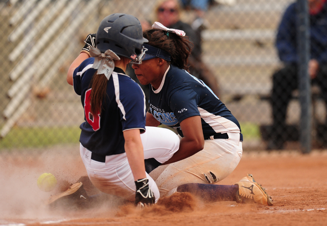 Coronado base runner Marissa Kopp scores a run on a passed ball while Foothill starting pitc ...