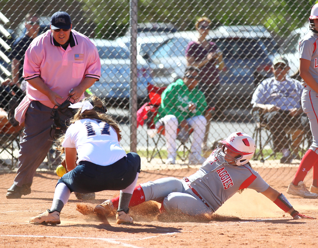 Arbor View’s Kayla Stephens slides home under the tag of Shadow Ridge’s Tana Fei ...