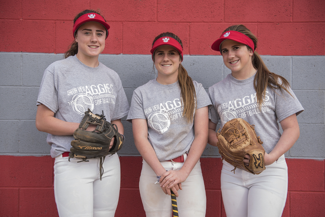 Triplets, from left, Brittany, Bryce and Breanne Henriksen, 16, pose for a portrait at Arbor ...