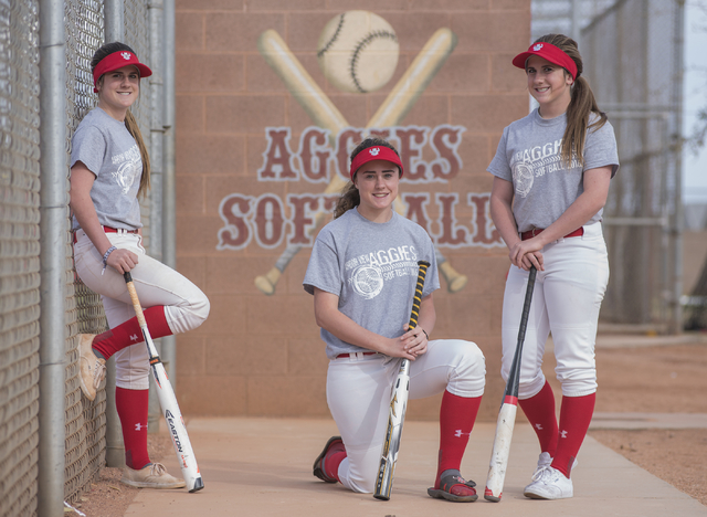 Triplets, from left, Bryce, Brittany and Breanne Henriksen, 16, pose for a portrait at Arbor ...