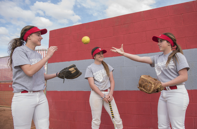 Triplets, from left, Brittany, Bryce and Breanne Henriksen, 16, hang out at Arbor View High ...