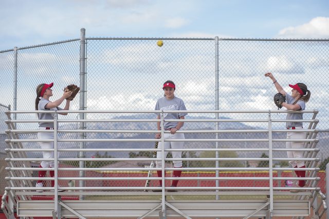 Triplets, from left, Bryce, Brittany and Breanne Henriksen, 16, pose for a portrait at Arbor ...