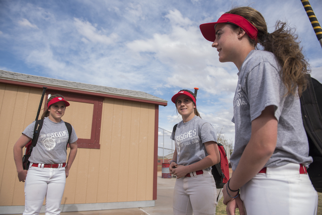 Triplets, from left, Breanne, Bryce and Brittany Henriksen, 16, hang out at Arbor View High ...