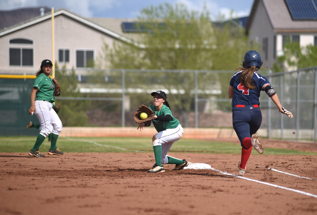 Rancho’s Jazmin Gonzalez (2) catches the ball for an out at first base against Coronad ...