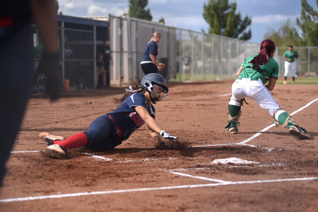 Coronado’s Basia Query (9) slides into home against Rancho during their softball game ...