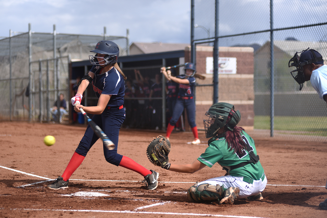 Coronado’s Tatum Spangler (5) swings at a pitch against Rancho during their softball g ...