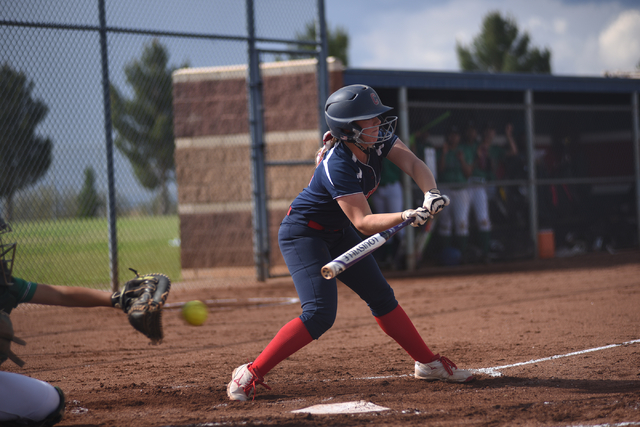 Coronado’s Brooke Younie (12) checks her swing on a pitch against Rancho during their ...