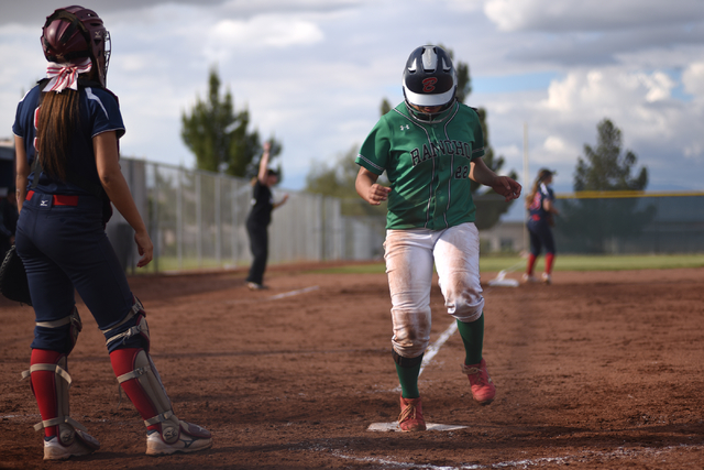 Rancho’s Tiara Lee (22) scores a run against Coronado during their softball game playe ...