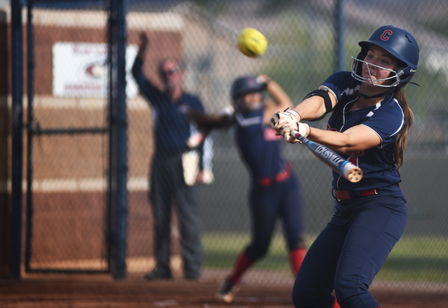 Coronado’s Dylan Underwood (4) swings at a pitch against Rancho during their softball ...