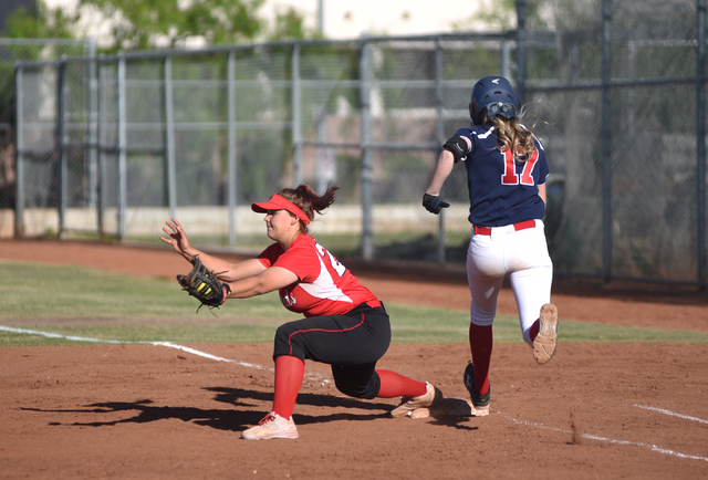 Las Vegas High School’s Kaitlyn Horstdaniel (20) catches the ball at first for an out ...