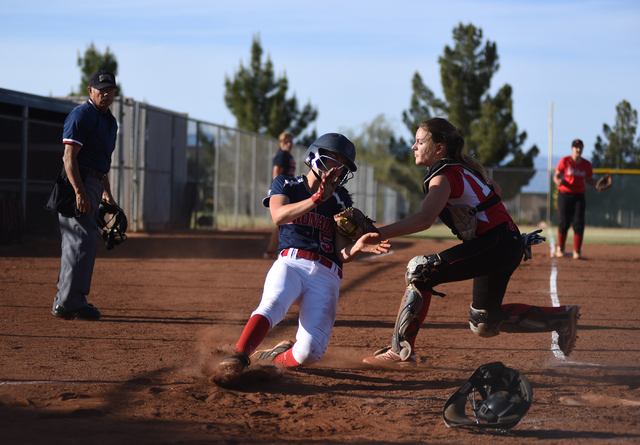 Las Vegas High School’s Arienn Ackerman (16) tags out Coronado’s Tatum Spangler ...