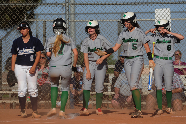 Palo Verde batter Cara Beatty (5) greets Camden Zahn (7) at home plate after three runs were ...