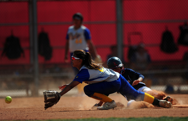 Liberty base runner Soraya Seumalo slides into second base after hitting an RBI double while ...