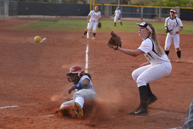 Sierra Vista’s Harmony Dominguez (14) slides at home for a run against Faith Lutheran ...