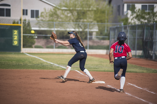 Spring Valley’s Madison Hood (11) catches a ball at first for an out against Coronado& ...