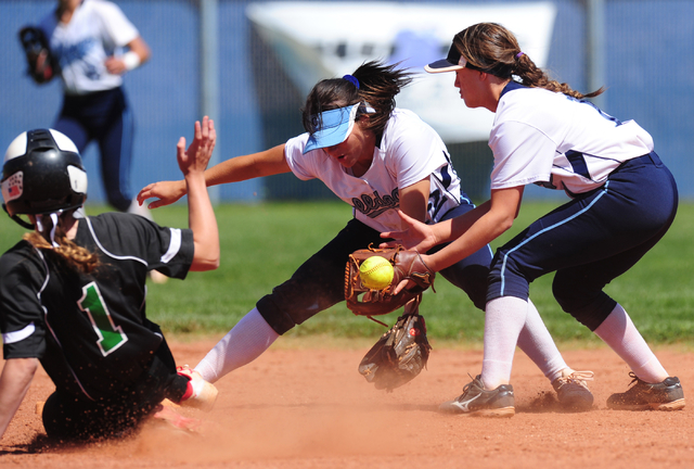 Palo Verde base runner Makall Whetten (1) slides into second base while Centennial shortstop ...