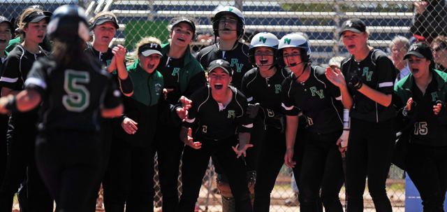 Palo Verde players greet Cara Beatty (5) after she hit a game tying two-run home run in the ...