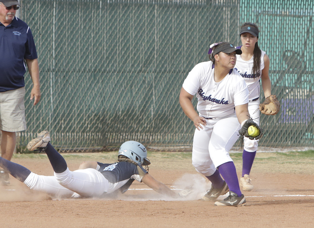 Foothill’s Caitlyn Stevenson returns to third on an attempt to home plate as Silverado ...