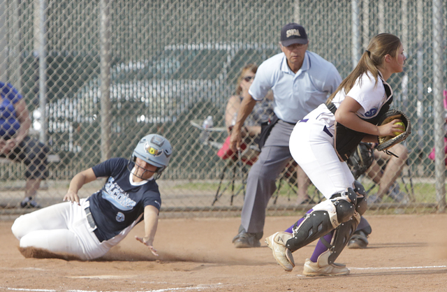 Foothill’s Alexa Campbell came home safe as Silverado catcher Erica Rolaes catches the ...