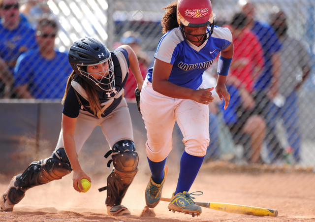 Spring Valley catcher Vivian Quiroz-Montano throws out Sierra Vista batter Harmony Dominguez ...