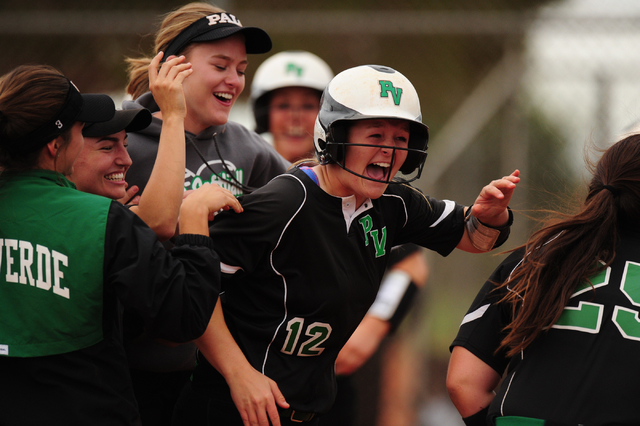 Palo Verde teammates swarm Allyson Snelling, center, after she hit a walk-off RBI single in ...