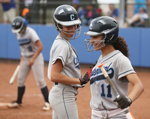 Centennial’s Angel Love, center, congratulates Jaden Tate, right, after Tate scored th ...