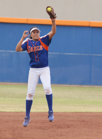 Bishop Gorman shortstop Shelby Estocado leaps to grab a high bounding ball against Centennia ...