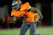 Bishop Gorman linebacker Ikem Okeke (22) returns a Brophy Prep interception in the first hal ...