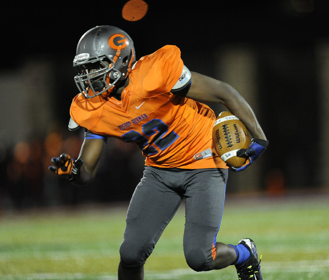 Bishop Gorman linebacker Ikem Okeke (22) returns a Brophy Prep interception in the first hal ...