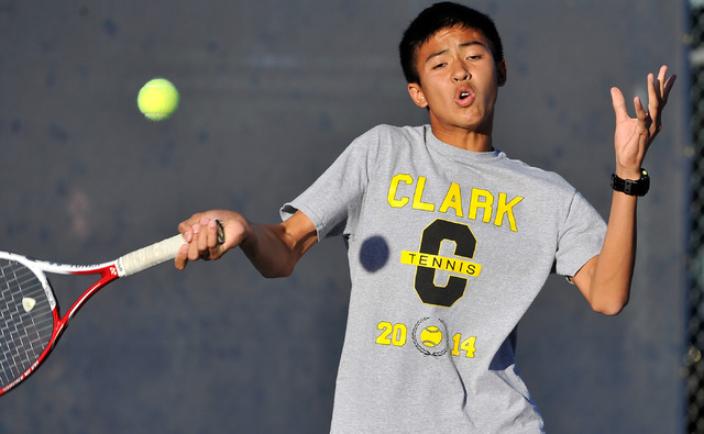 Clark’s Michael Pasimio returns the ball against The Meadows’ Kevin Chau during ...