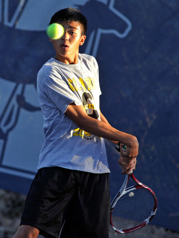 Clark’s Michael Pasimio returns the ball against The Meadows’ Kevin Chau during ...