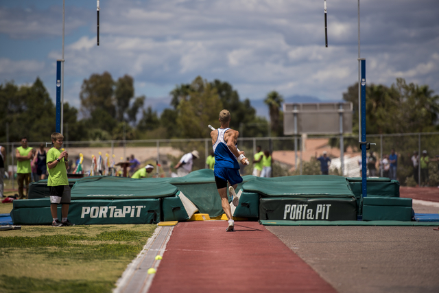 Caleb Witsken of Moapa Valley competes in the pole vault during the Nevada state track meet ...